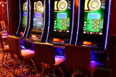 Live baccarat table with dealer dealing cards to Player and Banker positions